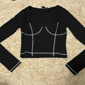 Long sleeve black top. Size S. New with tags.